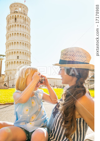 Baby girl taking photo of mother in front of leaning tower of pi Baby girl taking photo of mother in front of leaning tower of pi 17178988