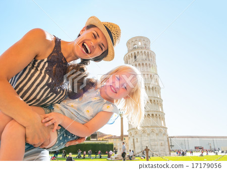 Portrait of mother and baby girl in front of leaning tower of pi Portrait of mother and baby girl in front of leaning tower of pi 17179056