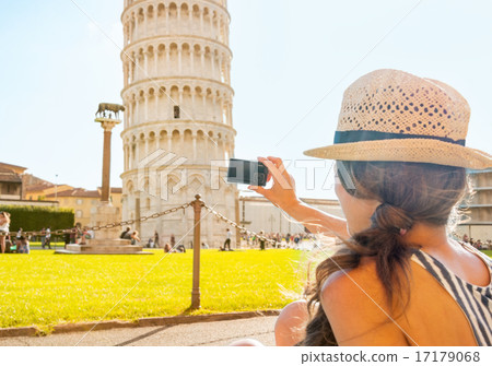 Young woman taking photo of leaning tower of pisa, tuscany, ital Young woman taking photo of leaning tower of pisa, tuscany, ital 17179068