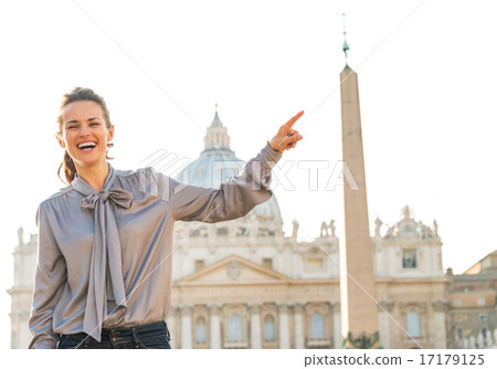 Happy young woman on piazza san pietro in vatican city state poi 17179125