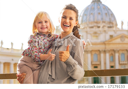 Portrait of happy mother and baby girl on piazza san pietro in v 17179133