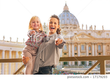 Happy mother and baby girl on piazza san pietro in vatican city 17179203