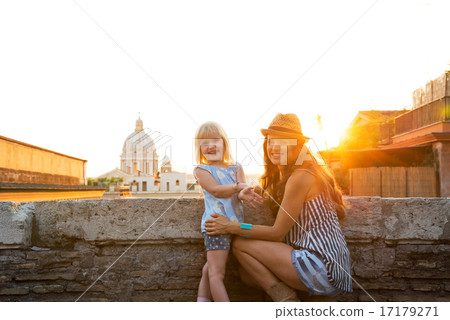 Portrait of happy mother and baby girl on street overlooking roo Portrait of happy mother and baby girl on street overlooking roo 17179271