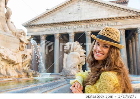 Portrait of smiling young woman near fountain of the pantheon in Portrait of smiling young woman near fountain of the pantheon in 17179273