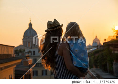 Silhouette of mother and baby girl looking on rooftops of rome o Silhouette of mother and baby girl looking on rooftops of rome o 17179320