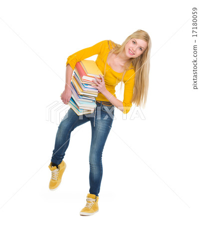 Full length portrait of student girl holding pile of books 17180059