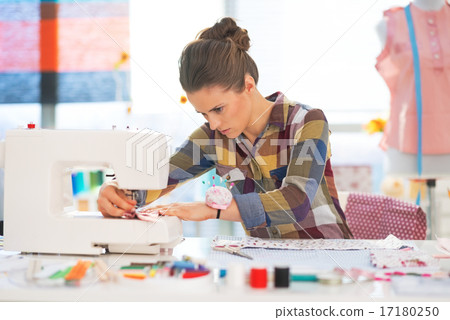 Seamstress working in studio Seamstress working in studio 17180250