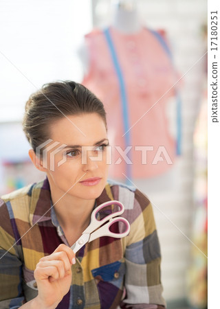 Portrait of thoughtful seamstress in studio Portrait of thoughtful seamstress in studio 17180251