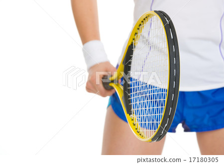 Closeup on tennis player holding tennis racket Closeup on tennis player holding tennis racket 17180305