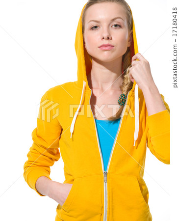 Portrait of serious teenager girl in sweater with draped hood Portrait of serious teenager girl in sweater with draped hood 17180418