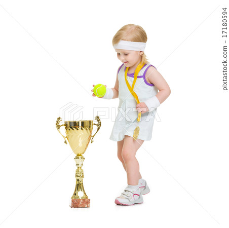 Baby in tennis clothes with medal and goblet Baby in tennis clothes with medal and goblet 17180594