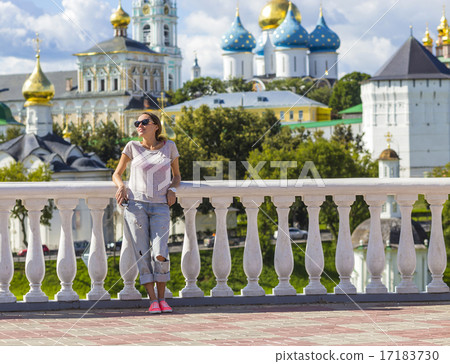 Young Woman in Sunglasses with Trinity Sergius Lavra in Sergiev Young Woman in Sunglasses with Trinity Sergius Lavra in Sergiev 17183730