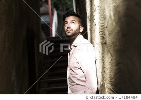 Portrait of young, depressed man in pain Portrait of young, depressed man in pain 17184484