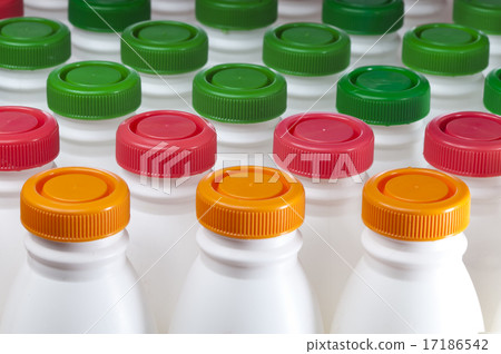 dairy products bottles with bright covers 17186542
