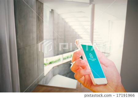 Composite image of hand holding smartphone 17191966