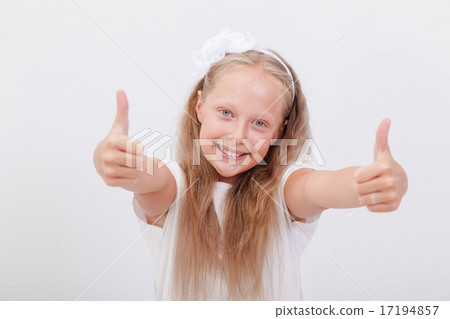 Portrait of a beautiful girl showing thumbs up on white 17194857