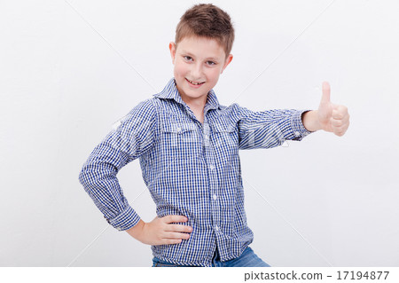Portrait of happy boy showing thumb up gesture Portrait of happy boy showing thumb up gesture 17194877