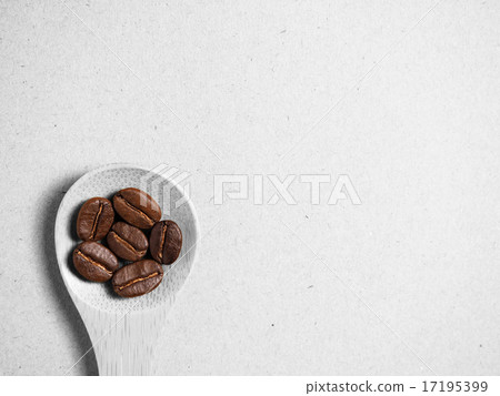 Coffee crop beans on bamboo spoon and paper Coffee crop beans on bamboo spoon and paper 17195399