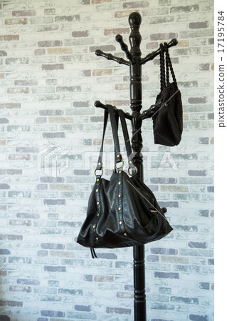 Clothes hang on a shelf in a designer clothes  17195784