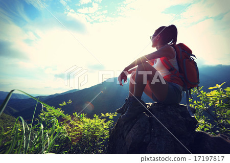 woman backpacker on mountain peak enjoy the view woman backpacker on mountain peak enjoy the view 17197817