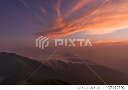 Clouds flowing through the mountains and clouds stained in the sunset 17199592