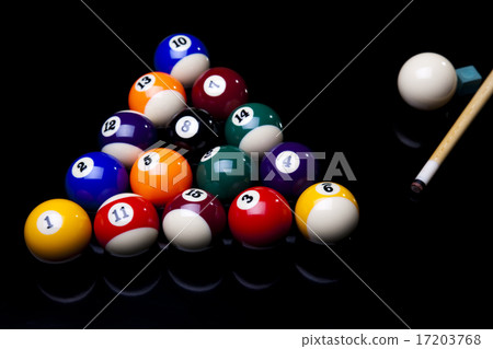 Pool game balls against a green 17203768