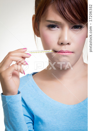 Sick woman holding thermometer 17206382