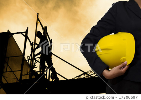 engineer holding Yellow helmet engineer holding Yellow helmet 17206697