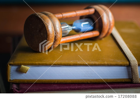 Hourglass placed on the book 17208088