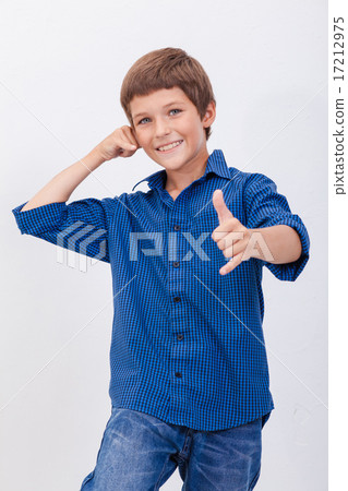 Happy young boy with calling gesture over white background Happy young boy with calling gesture over white background 17212975