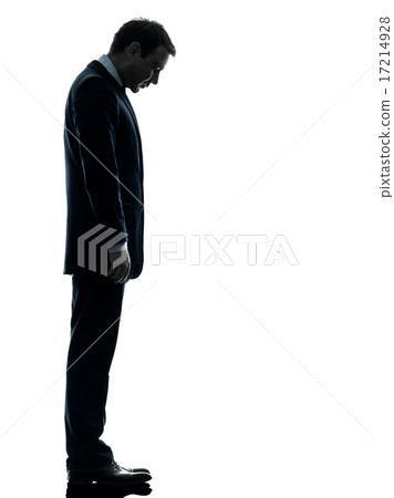 sad business man looking down silhouette sad business man looking down silhouette 17214928