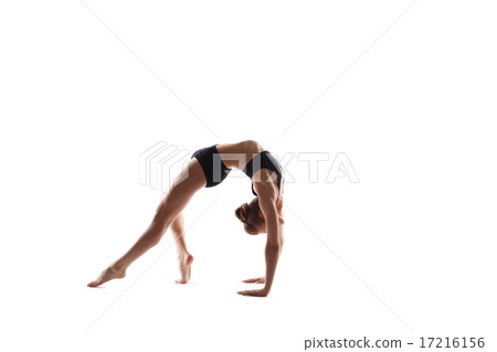 Girl doing exercise on stretching back muscles Girl doing exercise on stretching back muscles 17216156