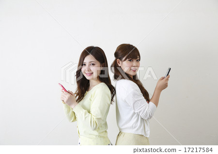 A woman using a smartphone A woman using a smartphone 17217584