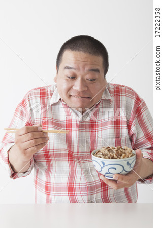 Middle-aged men taking a meal Middle-aged men taking a meal 17222358
