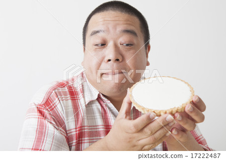 Middle-aged men taking a meal 17222487