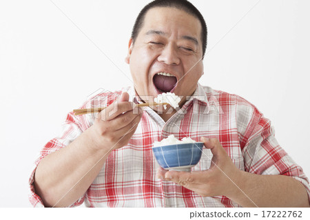 Middle-aged men taking a meal 17222762
