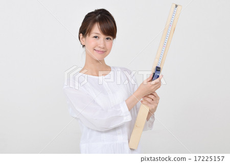 A woman measuring the horn at the scale A woman measuring the horn at the scale 17225157
