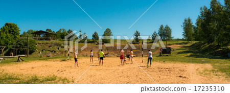 group of teenagers playing voleyball group of teenagers playing voleyball 17235310