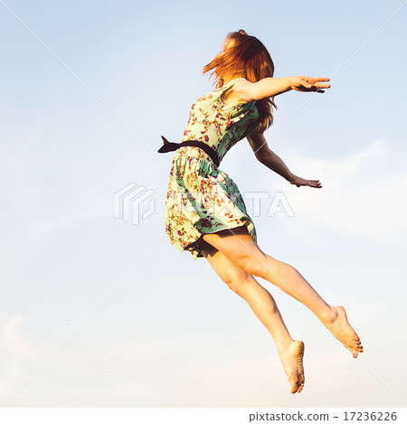 Happy Young Woman Jumping Happy Young Woman Jumping 17236226