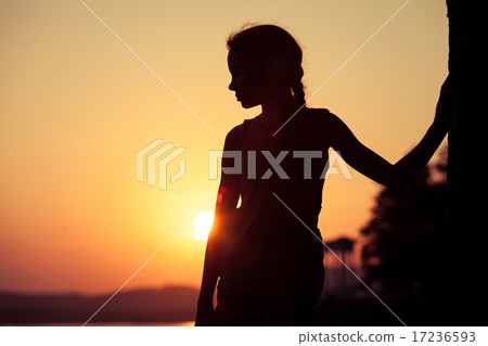 Portrait of sad blond little girl standing on the beach Portrait of sad blond little girl standing on the beach 17236593