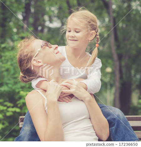 Mother and daughter playing at the park at the day time. 17236650