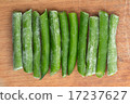 Frozen eleven sticks of asparagus on wooden 17237627