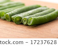 Frozen sticks of asparagus on wood background 17237628