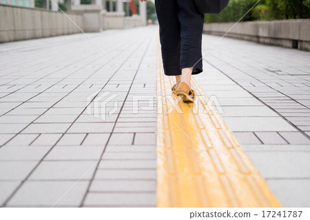 Women walking on the sidewalk guidance block 17241787