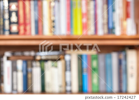 unfocused books on bookshelf 17242427