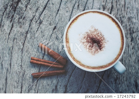 Cappuccino coffee with cinnamon sticks Cappuccino coffee with cinnamon sticks 17243792