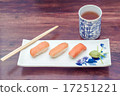 delicious sushi served  wooden table with tea 17251221