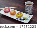 delicious sushi served  wooden table with tea 17251223