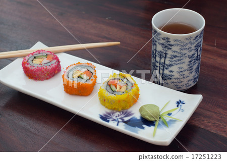 delicious sushi served  wooden table with tea 17251223
