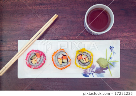 delicious sushi served  wooden table with tea 17251225
